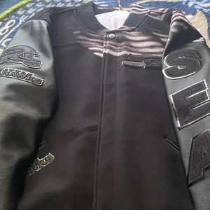 A black Seahawk varsity jacket